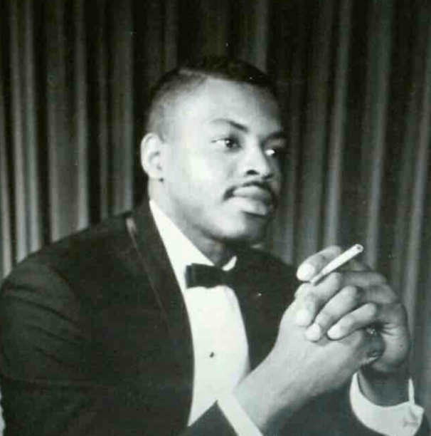 Vintage portrait of a distinguished Black man in a tuxedo, symbolizing pride, legacy, and generational grace.